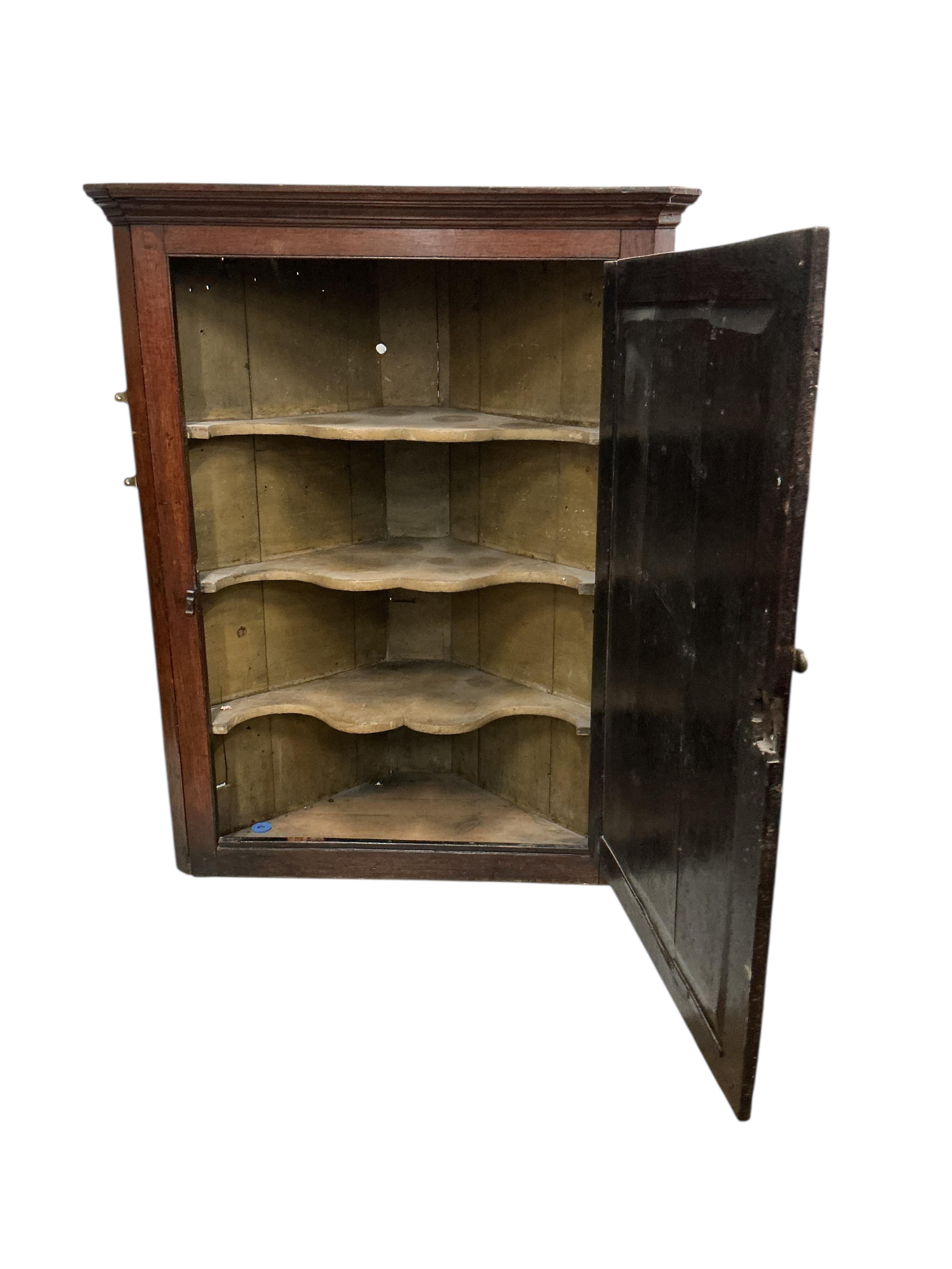 Two George III oak hanging corner cupboards, largest width 102cm, depth 48cm, height 128cm